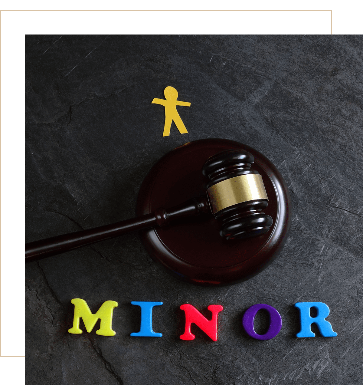 Gavel with colorful letters spelling minor